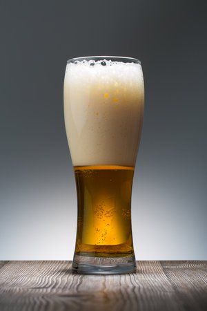 Beer. Cold Craft light Beer in a glass. Close up of a pint of beerの写真素材