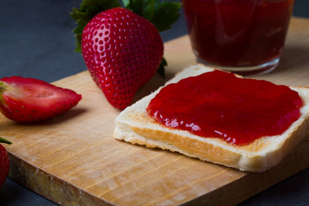 Strawberry jam is made from strawberries, This jam can be used for spreading white bread, filling cakes, etc.の写真素材