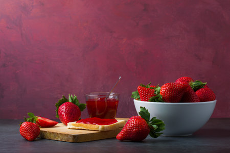 Strawberry jam is made from strawberries, This jam can be used for spreading white bread, filling cakes, etc.の写真素材
