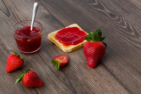 Strawberry jam is made from strawberries, This jam can be used for spreading white bread, filling cakes, etc.の写真素材