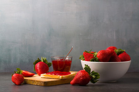 Strawberry jam is made from strawberries, This jam can be used for spreading white bread, filling cakes, etc.の写真素材