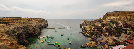 MELLIEHA, MALTA - AUGUST 06, 2018: panoramic view of the famous Popeye village in Malta.のeditorial素材