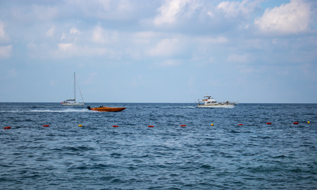 SLIEMA, MALTA - AUGUST 05, 2018: some boats moving in the sea on a summer day.のeditorial素材