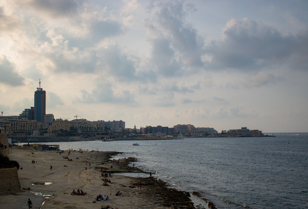 SLIEMA, MALTA - AUGUST 05, 2018: view from the sea in a cloudy day.のeditorial素材