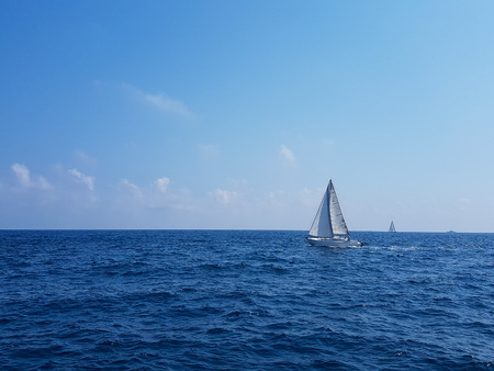 MALTA - 09 AUGUST 2018: a sailboat on a blue sea in a sunny day.のeditorial素材