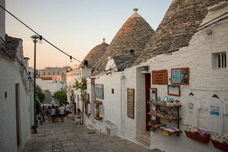 Alberobello, Italy - August 01, 2020: people walking and talking in the city of Alberobello, Italy.のeditorial素材