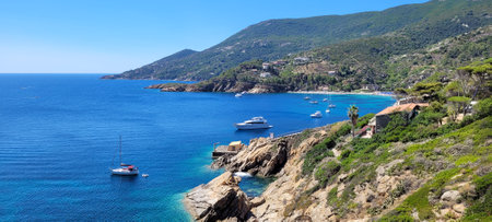 Isola del Giglio, Italy - July, 2022: spectacular sea view on Giglio Island. Some boats move on the sea on a sunny day.のeditorial素材