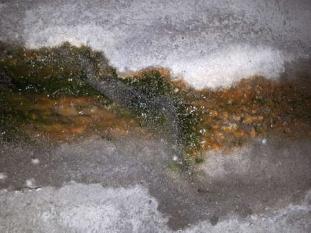 Drops of water trickling down the rocks in the tunnelの写真素材