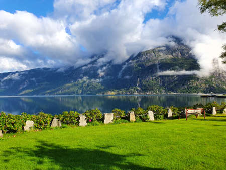white clouds over the fjord and meadow - Eidfjordの写真素材