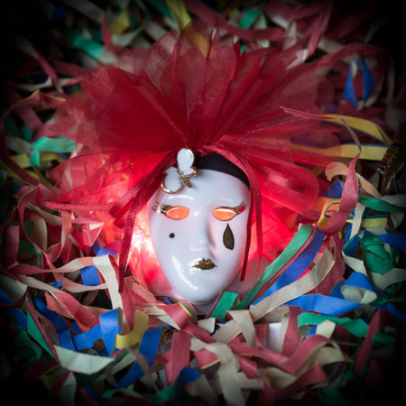 Pierrot carnival mask on a background of streamersの写真素材