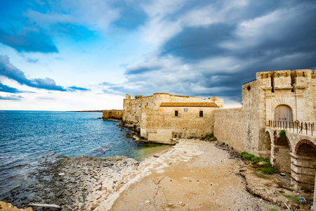 Beautiful view of Maniace castle in Ortigia Syracuse, in front of the sea and sky. Horizontal viewのeditorial素材