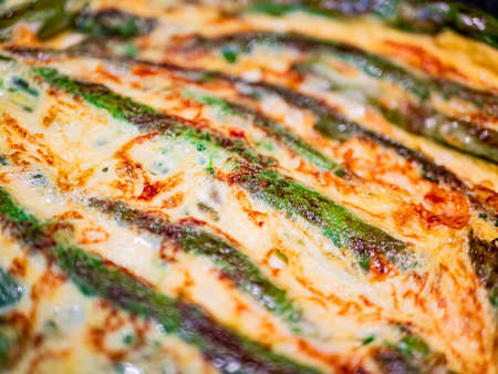 Asparagus cake with eggs oil and cheese. Horizontal viewの写真素材