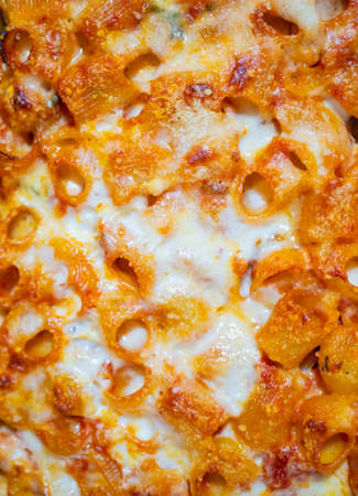 Baked italian pasta with bechamel. Typical Italian dish. Vertical view.
