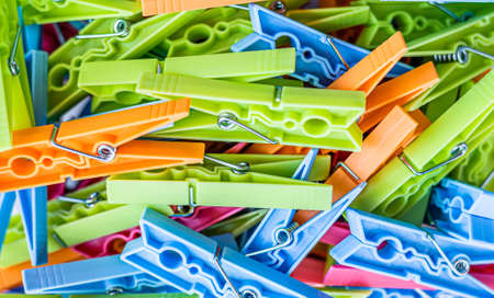 Pile of colorful clothespins. Close-up of various clothes pegs. Horizontal viewの写真素材