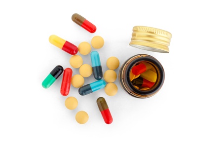 pills & bottle isolated on white backgroundの写真素材