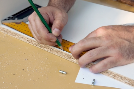 measuring and marking wood to cutの写真素材