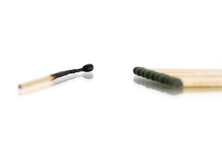 burnt and whole matches isolated on white backgroundの写真素材