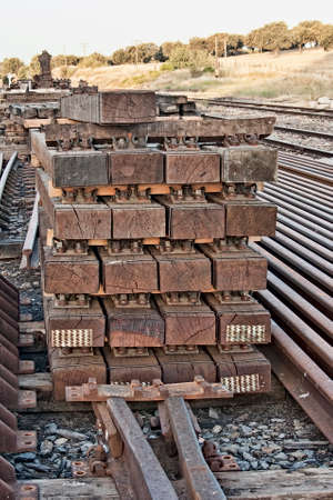 Close up rail track ties and gravel stones ground. Outdoors.の写真素材