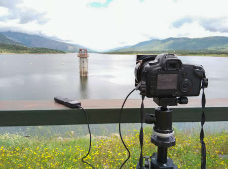 Taking a picture of the lake with a full frame camera, tripod and shutter