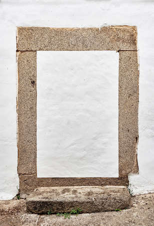 An old door bricked up with cement on a white background.の写真素材