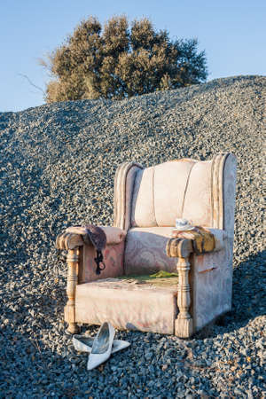 An abandoned sofa in a closed gravel pit that processed river stones. Outdoorsの写真素材