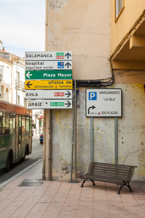 PLASENCIA, SPAIN - February 24, 2012: several signs indicating places at a crossroads in the center of Plasencia.のeditorial素材