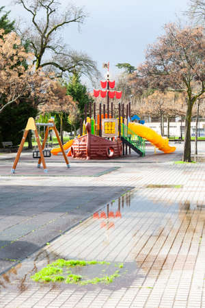 Plasencia, Caceres, Spain - February 08, 2021: Modern children playground in park during the coronavirus covid-19 pandemicのeditorial素材