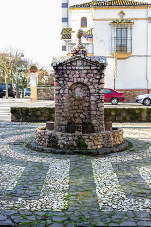 Plasencia, Caceres, Spain - February 07, 2021: Antique rose quartz fountain and four spouts in San Anton Parkのeditorial素材