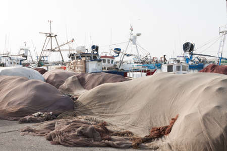 Torrox, Spain - June 27, 2012: Fishing nets and gear next to the fishing boats in the port of Torrox in the province of Malaga, Andalusia, Spain, Western Europe.のeditorial素材