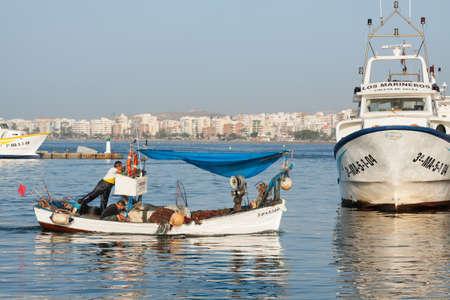 Torrox, Spain - June 29, 2012: Fishing boat coming back to pier after a hard working day in Torrox, in the province of Malaga, Andalusia, Spain.のeditorial素材