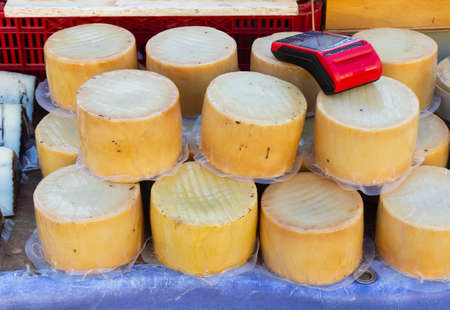 A dataphone above the portions of pure artisan sheep cheese to collect and pay avoiding contactの写真素材