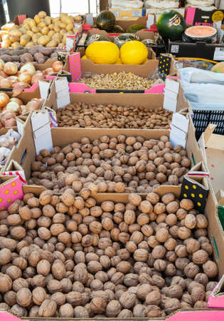Plasencia, Spain - March 23, 2021: Sale of nuts in bulk and all kinds of fruits in a street market