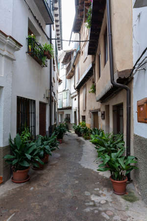 Villanueva de la Vera, Spain - March 08, 2021: View of a typical potted street with coves and traditional architectureのeditorial素材