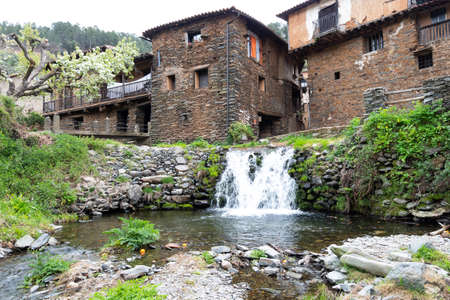 Robledillo de Gata, Spain - March 27, 2021: A waterfall on the Arrago river in Robledillo de Gata,...