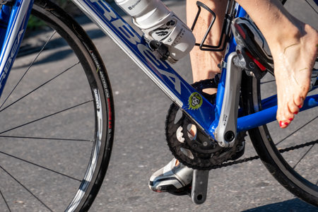 Fitness athletes pedaling their bikes during a national Triathlon, swimming, cycling and running events.のeditorial素材