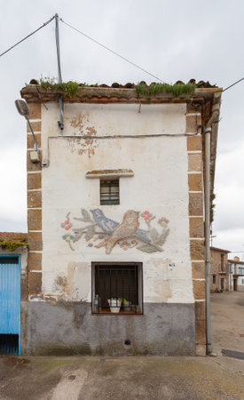 Oliva de Plasencia, Spain - April 08, 2021: An old house adorned with knitting and sewing craftsのeditorial素材