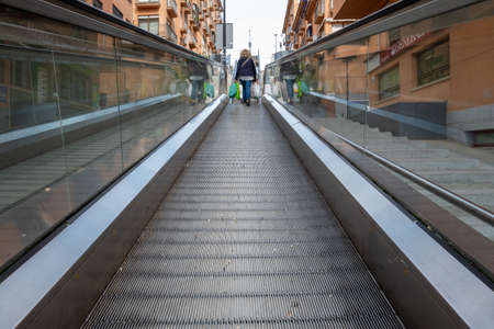 Modern escalators that link the islands parking lot with the city center to facilitate access for...