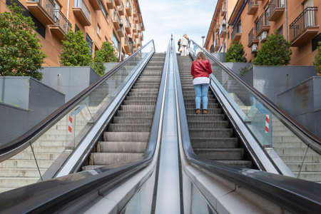 Modern escalators that link the islands parking lot with the city center to facilitate access for...
