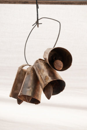 Four new metal cowbell used to locate cattleの写真素材