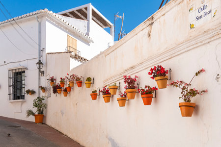 Estepona, Malaga, Spain - June 07, 2022: Typical Andalusian street decorated with pots and flowers in Estepona, Costa del Sol, Spainのeditorial素材