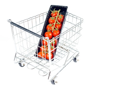 shopping cart with tomatoesの写真素材