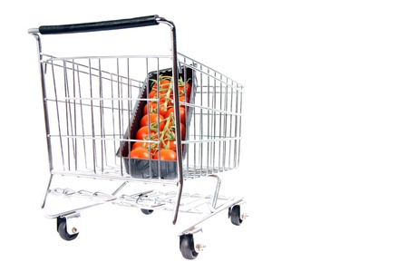 shopping cart with tomatoesの写真素材