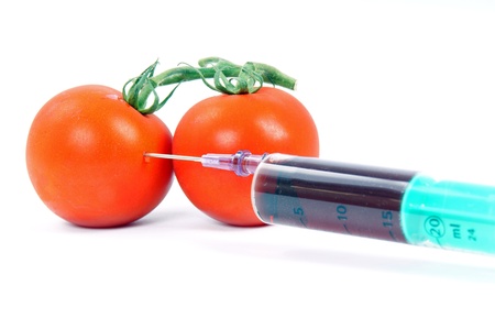 syringe and tomatoesの写真素材
