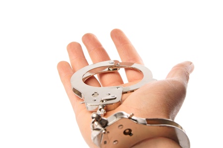 Handcuffs and a Handの写真素材