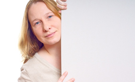 Young woman with a billboard の写真素材
