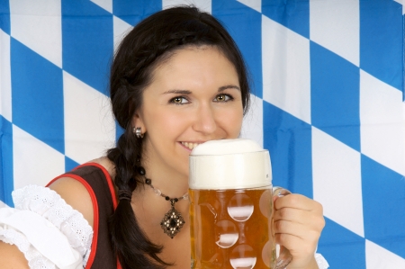 young pretty woman in a dirndl and Pintの写真素材