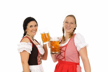Two young pretty women in dirndl with beer mugの写真素材
