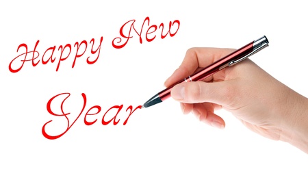 Hand with pen writing Happy New Year
