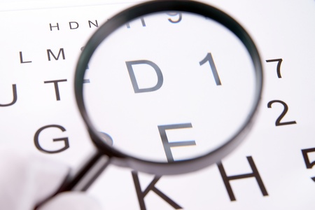 Eye chart and magnifying glassの写真素材