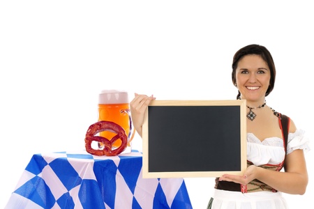 pretty woman in dirndl with blank sign and beer mugの写真素材